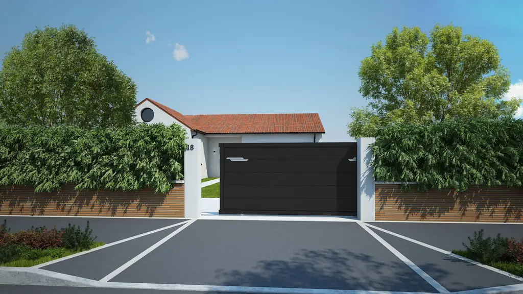 Portail coulissant plein noir devant une maison